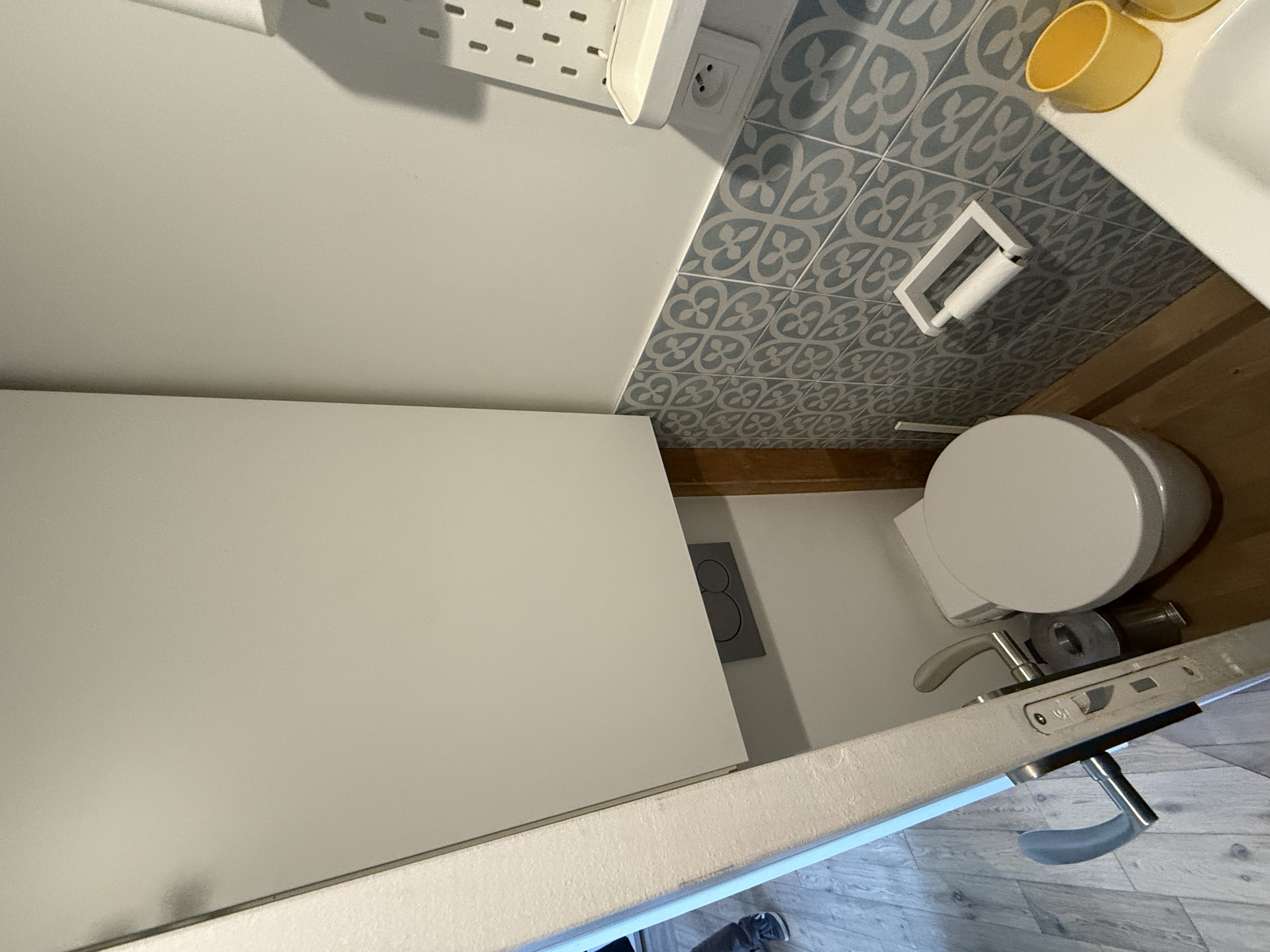 Toilet with patterned wall tiles